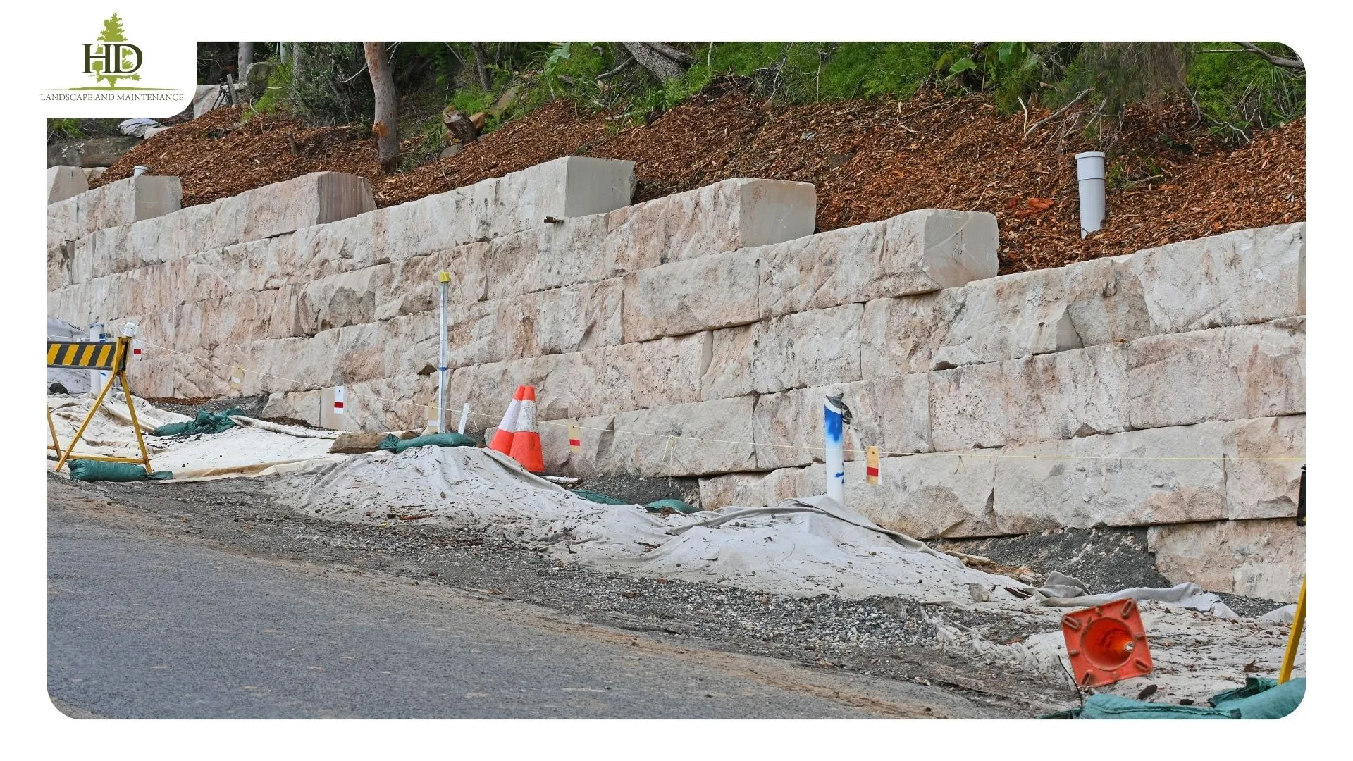 Completed block retaining wall with terraced planting bed on a hillside lot near Oregon City, Clackamas County
